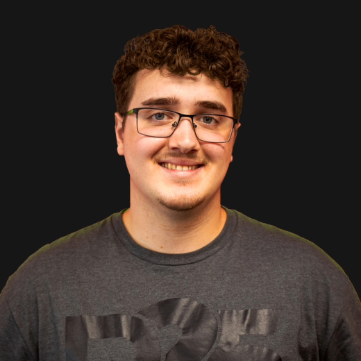 A picture of Ben on a dark grey background