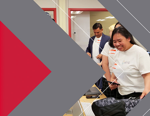 Students talking at industry night with Fanshawe branded arrows overlaid on top as a video transition