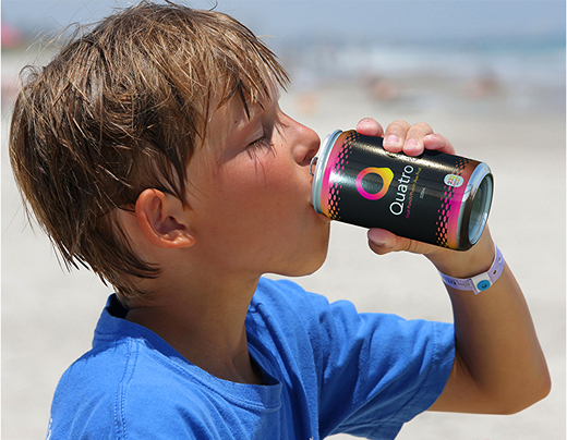 A picture of a bor drinking Quatro on the beach